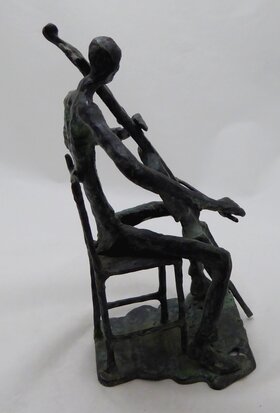 Bronze sculpture of a cello player