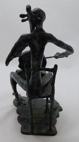 Bronze sculpture of a cello player