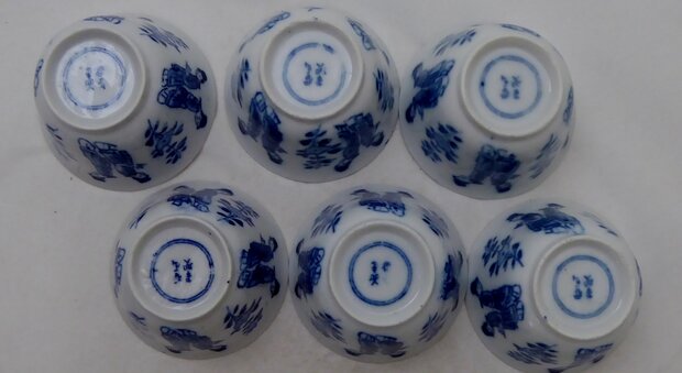 Antique sake cups with geisha ladies